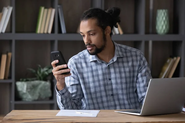Focused millennial Afro American business man using gadgets at workplace — Fotografia de Stock