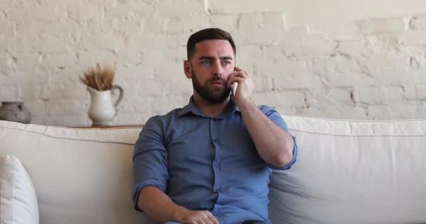 Happy millennial man involved in pleasant conversation on cellphone — Video Stock