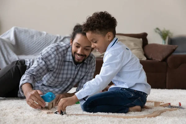 Happy Black father and cute curly haired son playing together — 图库照片