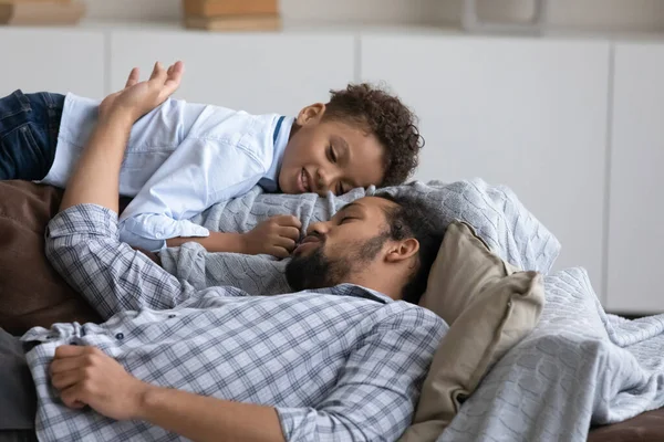 Calm happy dad and son boy resting, sleeping on sofa — Foto Stock