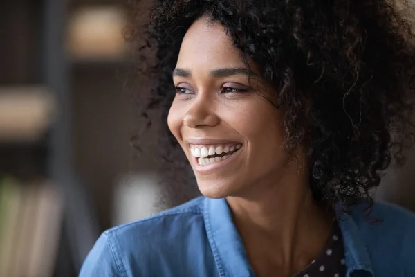 Happy cheerful pretty Black girl looking away with toothy smile — Stockfoto