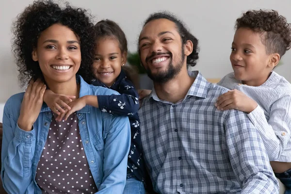 Happy couple with two funny adorable kids having fun together — Foto de Stock