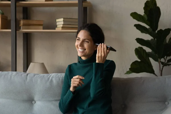 Happy woman listening audio message on cellphone. — Stock Photo, Image