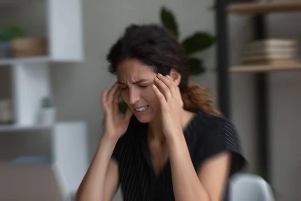 Unhappy stressed young woman suffering from headache. — Foto Stock