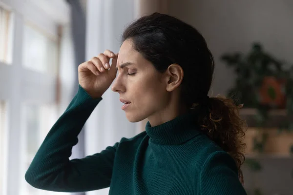 Stressed young hispanic woman suffering from depression. — стоковое фото