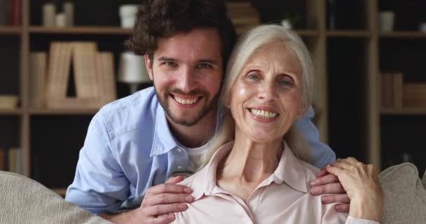 Close up portrait older woman her young adult 35s son — 비디오