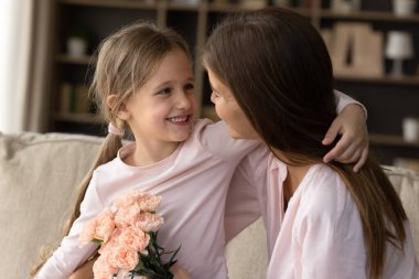 Young mom and little 5s daughter celebrate International Women Day