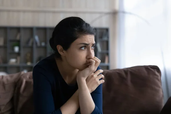 Thoughtful young Indian ethnic woman suffering from problems. — Foto Stock