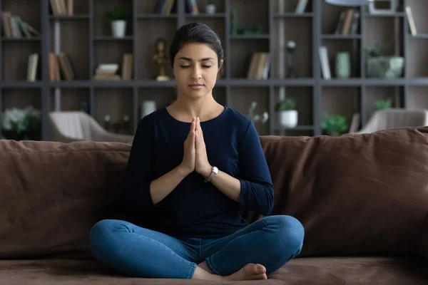 Happy peaceful young Indian woman praying God. — Fotografia de Stock