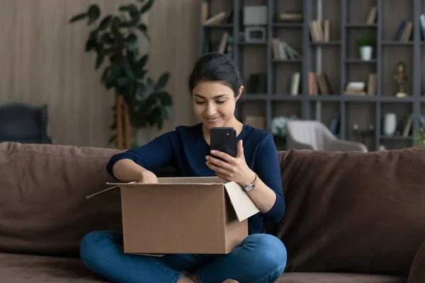 Happy young Indian woman satisfied with online shopping. — Foto de Stock