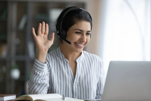 Happy attractive millennial Indian woman starting video call meeting. — Stock Photo, Image