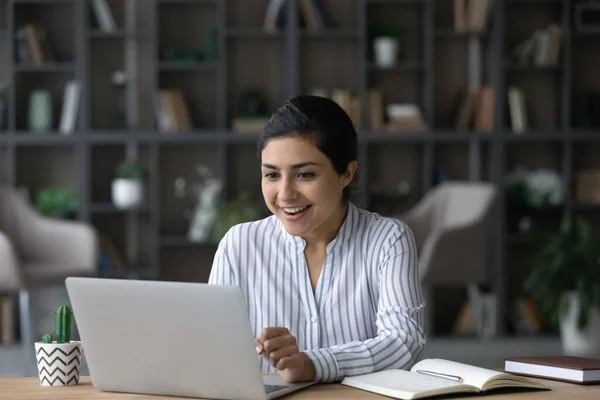 Amazed happy young Indian woman celebrating getting good news. — Foto Stock