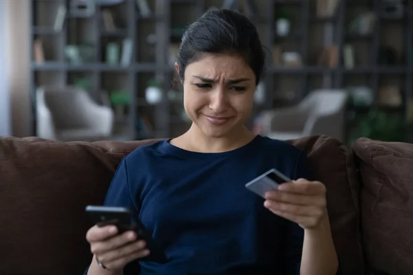 Stressed frustrated young Indian woman having problems with internet shopping. — Stock Photo, Image