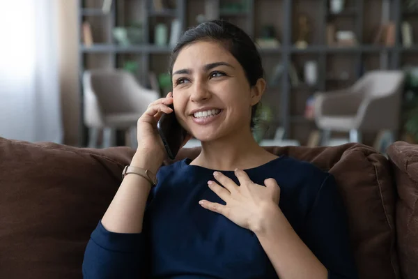 Smiling beautiful young Indian woman holding cellphone conversation. — Stock Fotó