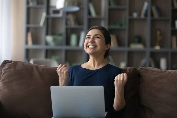 Overjoyed young Indian woman celebrating getting good news. — Foto de Stock