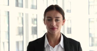 Headshot portrait successful young 30s businesswoman smile look at camera