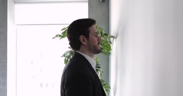 Businessman lean his head against wall looks stressed having problems — Video Stock