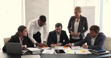 Diverse employee work on project financial statement profit result