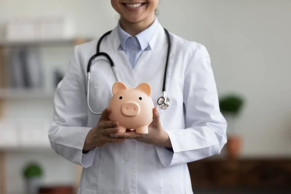 Close up happy young Indian doctor advertising medical insurance. — Stok fotoğraf