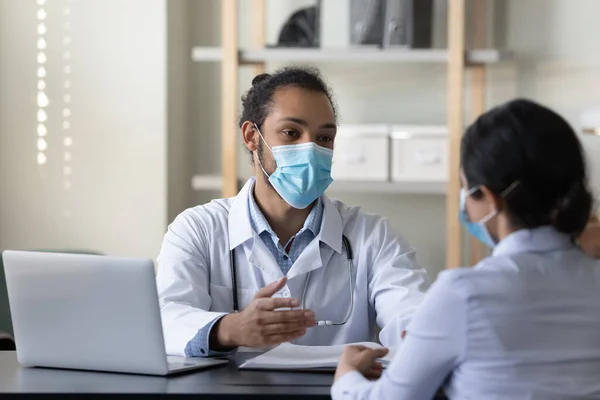 Happy diverse doctor and patient talking in office. — Foto Stock