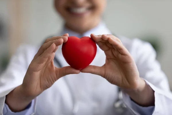 Close up focus on heart figure in hands of doctor. — Stock Photo, Image