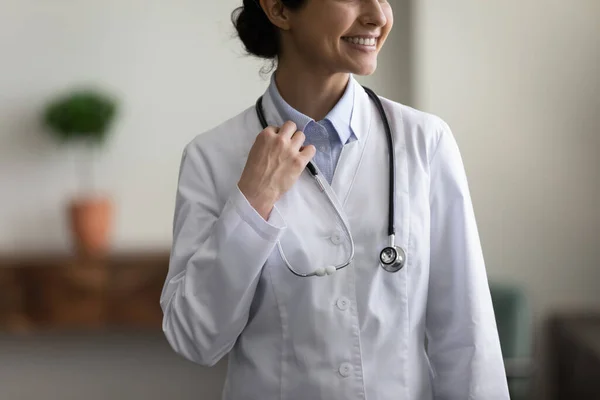 Close up smiling Indian doctor posing in clinic office. — Stockfoto