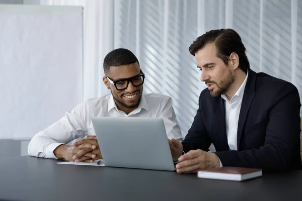 Diverse office employees in formalwear of using laptop computer together — Stock Photo, Image