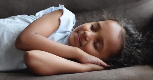 Closeup Indian cute peaceful girl sleeping on sofa at home — Stock Video