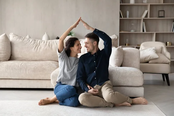 Happy homeowners celebrating relocation, moving into new home — Stock Photo, Image