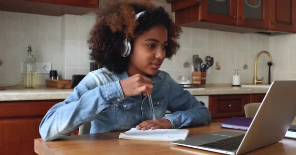 African teenage girl use modern tech e-learning from home — Stock Video