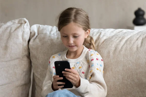 Digital addicted kid engaged in smartphone using, watching media — Stock Photo, Image