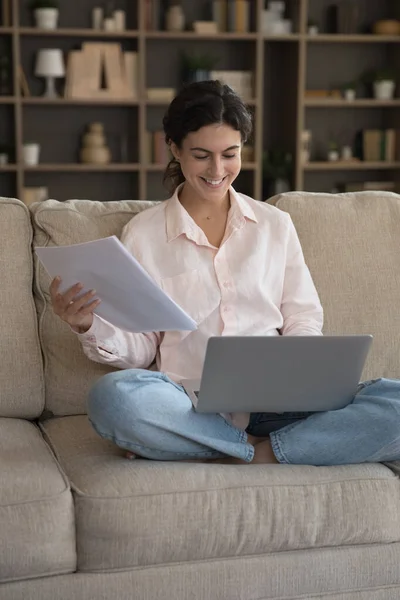 Vertical image joyful young Hispanic woman involved in paperwork — Stock Photo, Image