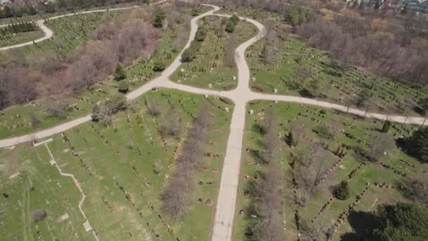 Aerial top very high view of modern cemetery at the city. Small headstones and crosses at graveyard with gravestones. — Stock Video