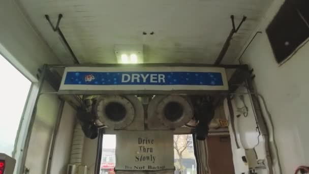 Toronto, Ontario, Canada - May 2, 2022 Car washing in the Toronto Touchless car wash. No brushes used to wash the vehicle to preserve the exterior from damage. View from the driver cabin. Self served — ストック動画