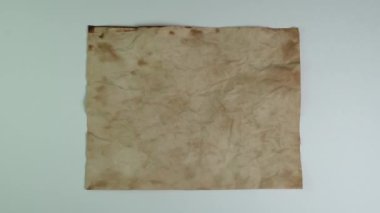 Old witch book empty page on white background for keying. Bewitched grimoire weathered page top view. Blank witchcraft or magic book page. Scrolls manuscripts or spells. Mystic occult concept.