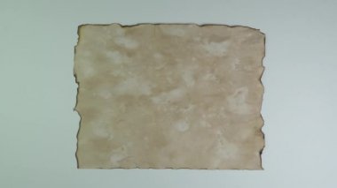 Old witch book empty page on white background for keying. Bewitched grimoire weathered page top view. Blank witchcraft or magic book page. Scrolls manuscripts or spells. Mystic occult concept.