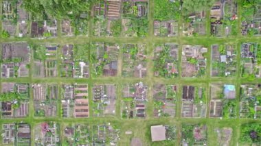 Homesteading life style and self-sufficient food preserving concept. Modern permaculture in the city neighbourhoods with small farms and urban family gardens. Aerial view.