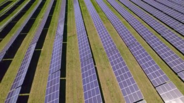 Solar panels aerial view. Modern photovoltaic electricity system created electric power generation without deforestation and environment impact. Green energy and Climate change concept.