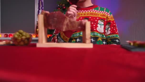 Young Man Sits Festive Table Eating Jamon Drinking Wine Wearing — Stock Video