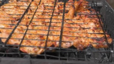 Barbecue on the grill is on an iron grill, cooking. High quality 4k footage