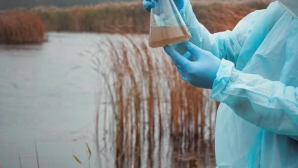 Side View Young Student Scientist Looks Polluted Water Test Flask — Stock Video