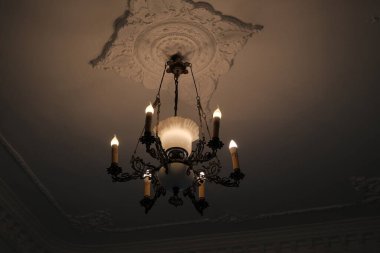 Traditional, ancient and antique style candelabra and light illumination on wall.