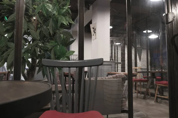 interior of a modern cafe, cafe designed vintage and retro style chairs and tables.