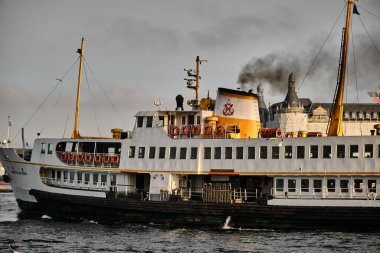 02.25.2022. istanbul. Turkey.  Public transportation ship, passenger ship and  black smoke outlet, the old port of the city of istanbul, 