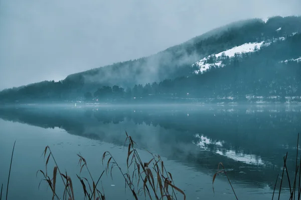 picturesque view of outdoor scene in Bolu at winter, Abant Lake in winter, reflection of hill on lake.