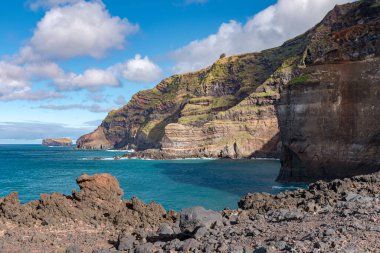 Rocky cliffs in the western part of Sao Miguel island, near Ponta da Ferraria. Azores, Portugal.