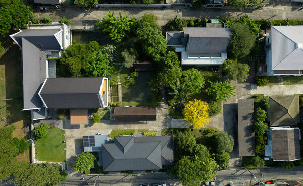 Aerial view of the roof of a house with a car taken by a drone, top view of roa
