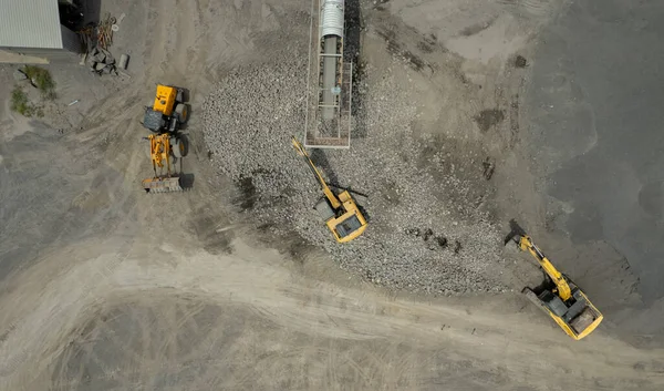 stock image excavator scooping rock, heavy work