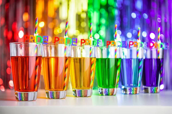 Rainbow drink. Glass of cocktail. Pride juice straw. Rainbow flag, symbol gays and lesbians LGBT, LGBTQ. Rainbow colors. Good for Party, greeting card. High resolution photo. Rainbow background.