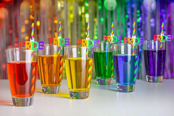 Rainbow drink. Glass of cocktail. Pride juice straw. Rainbow flag, symbol gays and lesbians LGBT, LGBTQ. Rainbow colors. Good for Party, greeting card. High resolution photo. Rainbow background.